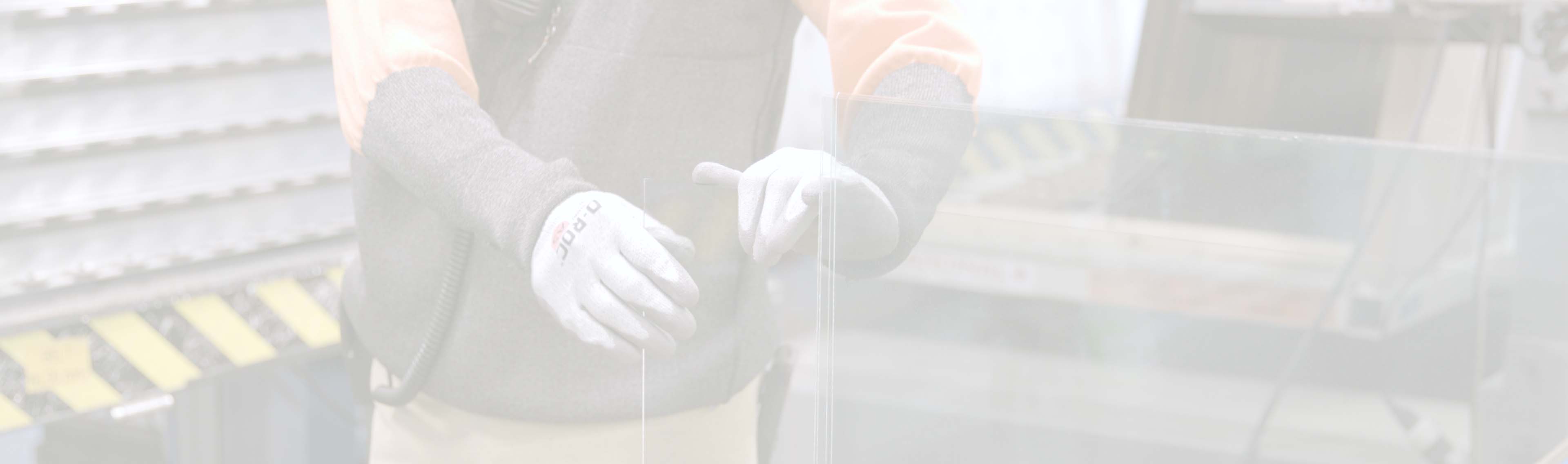 A worker handles glass at the Cardinal SGIG factory.
